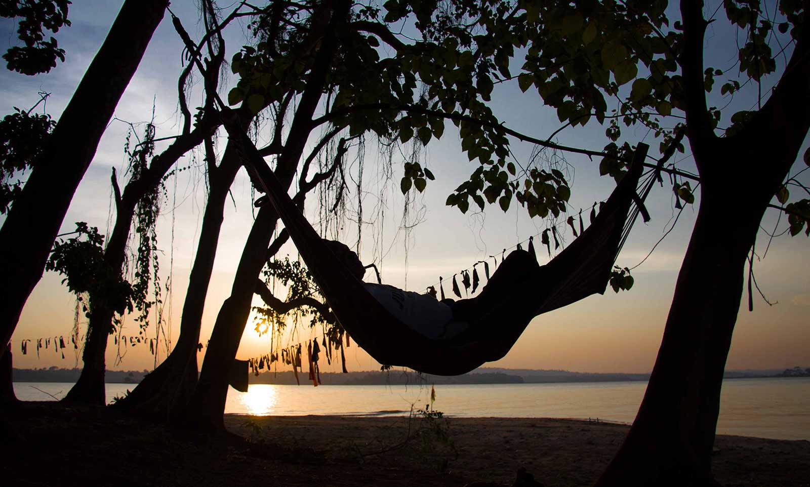Relaxing in hammock on Lunkulu Island beach